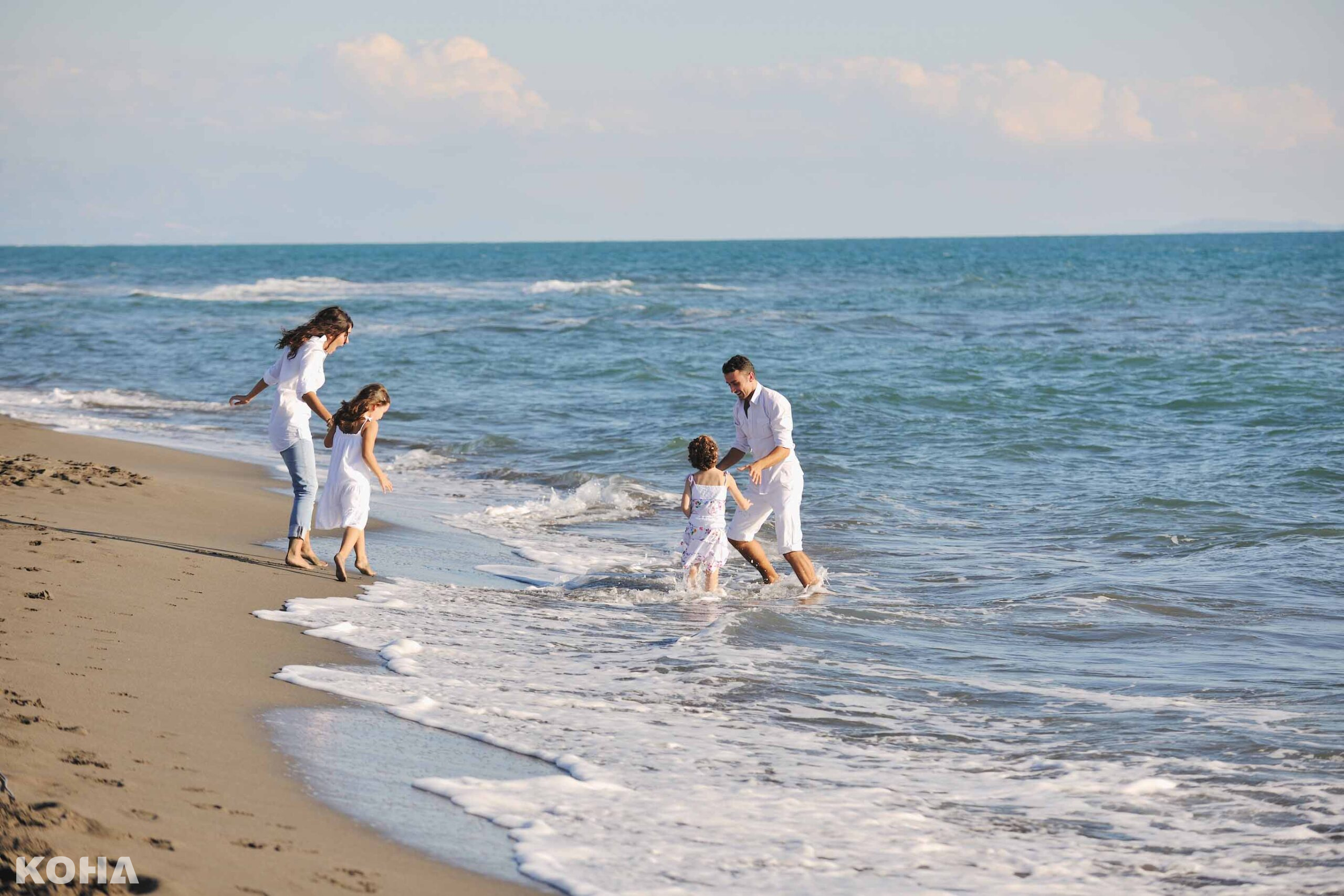 Tunis Family Playing on Beach scaled